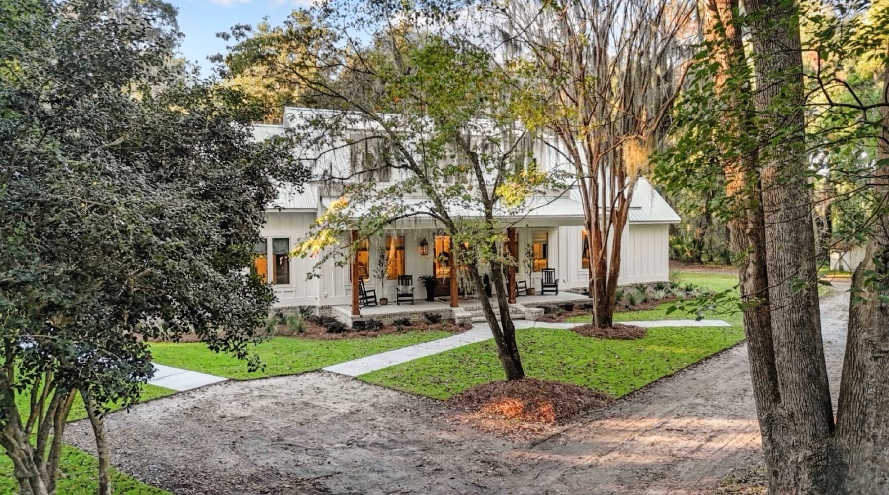 The white farmhouse salon beneath live oaks and Spanish moss on Colonel's Island