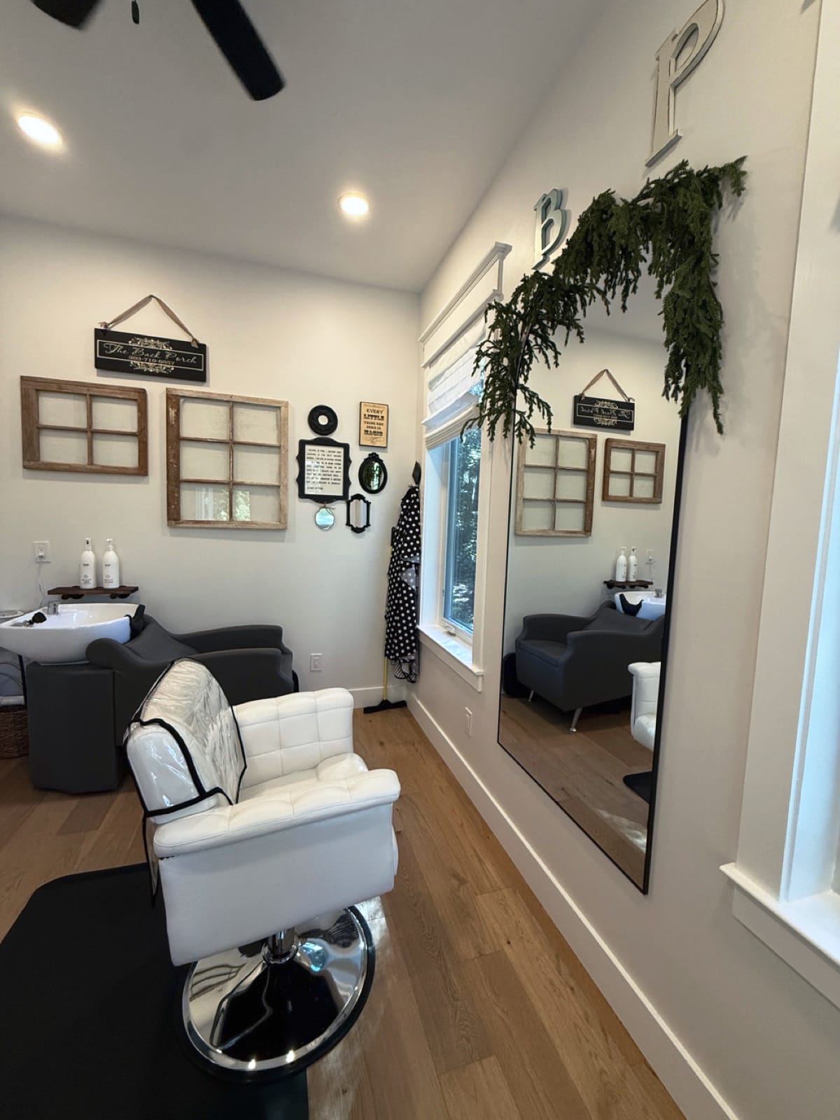 Styling chair and shampoo station in the bright white studio